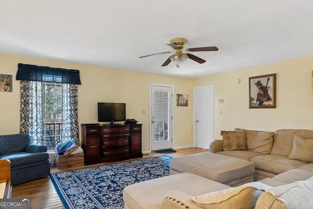 a living room with furniture and a rug