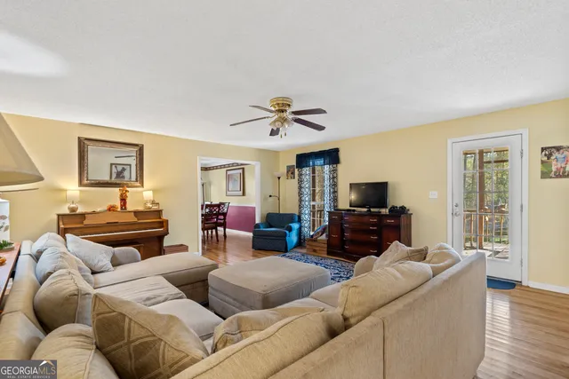 a living room with furniture and a rug