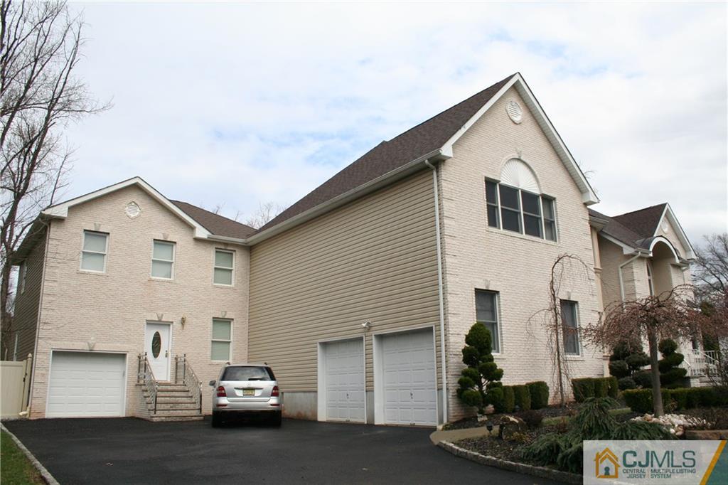 28 Chandler Road Edison, NJ 08820 - Photo 2 of 25 a view of a car park in front of house