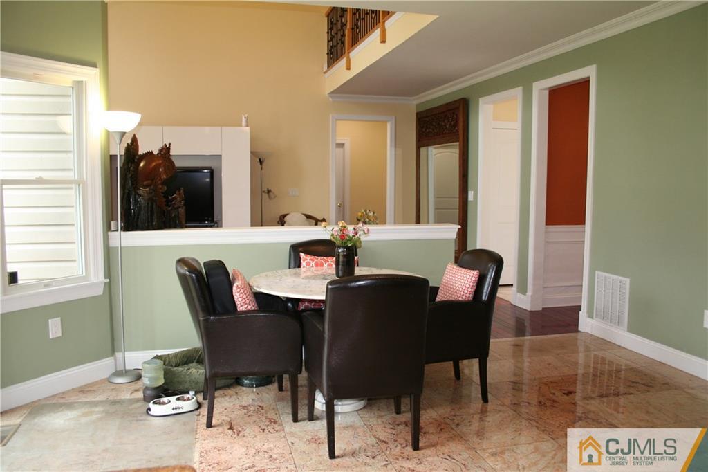 28 Chandler Road Edison, NJ 08820 - Photo 13 of 25 a view of a dining room with furniture and window