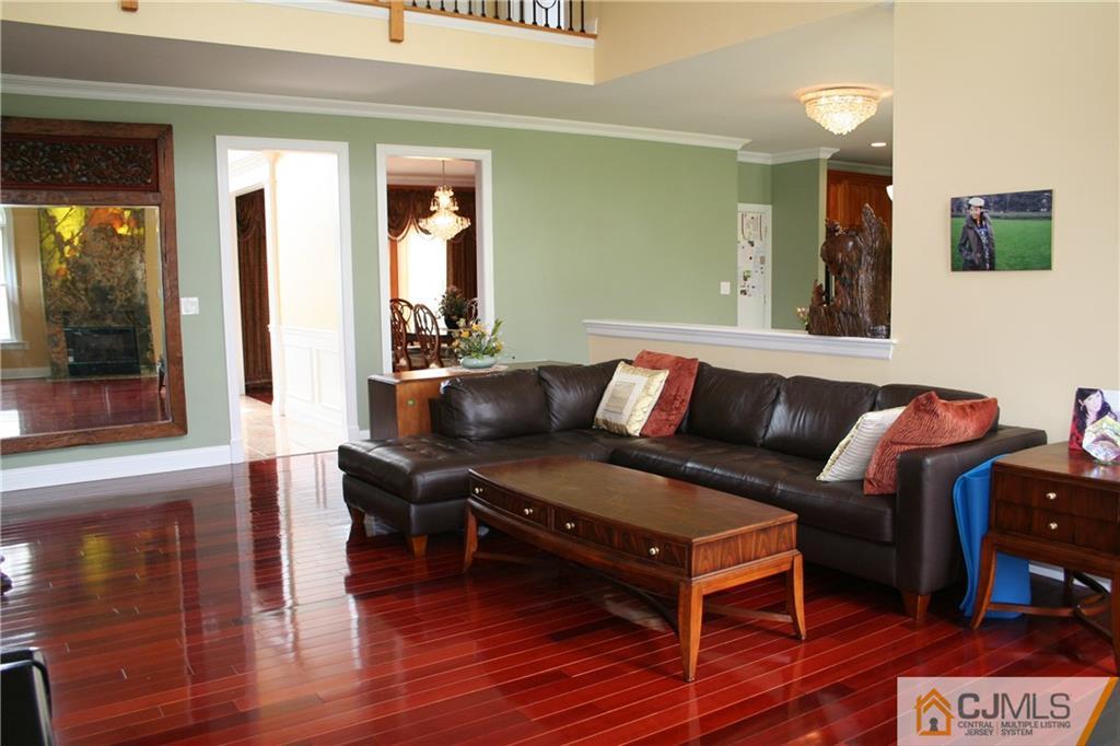 28 Chandler Road Edison, NJ 08820 - Photo 15 of 25 a living room with furniture and wooden floor