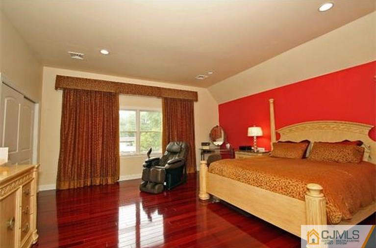 28 Chandler Road Edison, NJ 08820 - Photo 18 of 25 a bedroom with double bed and a large window