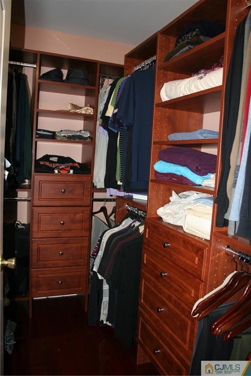 28 Chandler Road Edison, NJ 08820 - Photo 22 of 25 a view of walk in closet with clothes and shoes