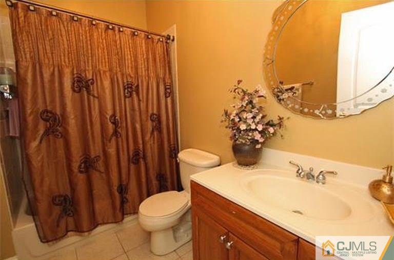 28 Chandler Road Edison, NJ 08820 - Photo 24 of 25 a bathroom with a sink toilet and shower