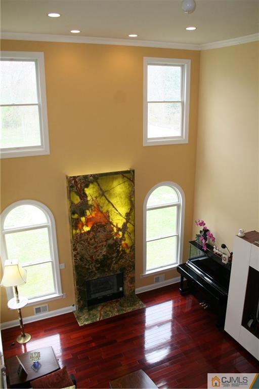28 Chandler Road Edison, NJ 08820 - Photo 8 of 25 a living room with fireplace furniture and a flat screen tv