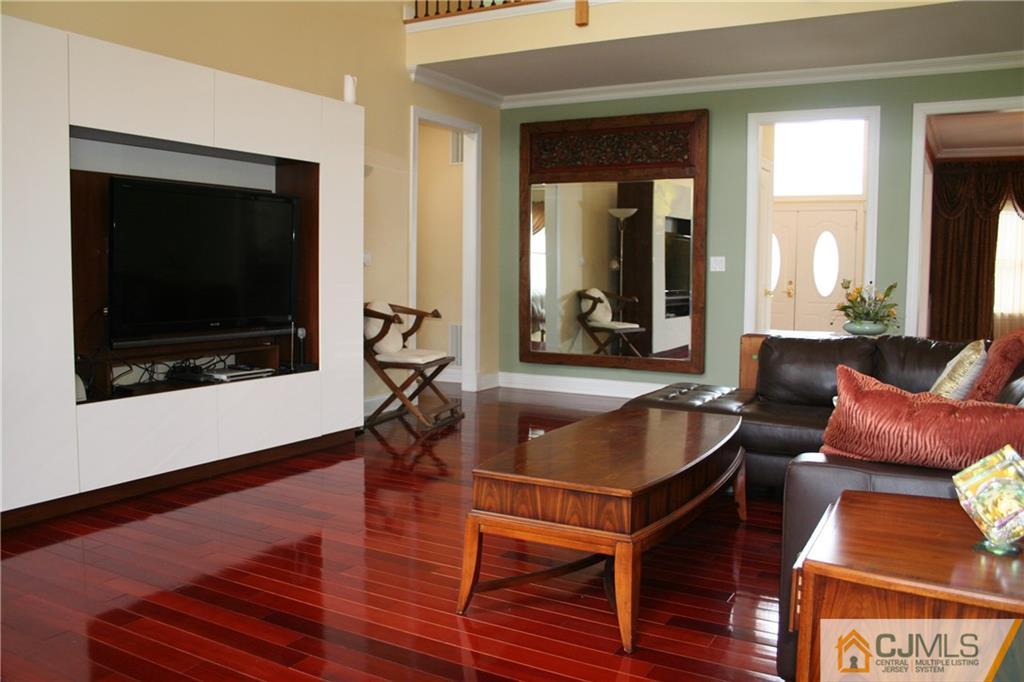 28 Chandler Road Edison, NJ 08820 - Photo 9 of 25 a living room with furniture and a flat screen tv