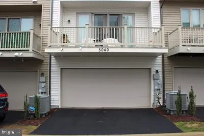 a view of a house with a street