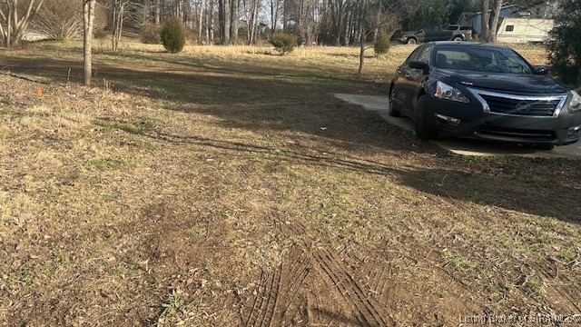 7725 Greenbrier Road Northeast Georgetown, IN 47122 - Photo 12 of 16 Back yard view/concrete pad