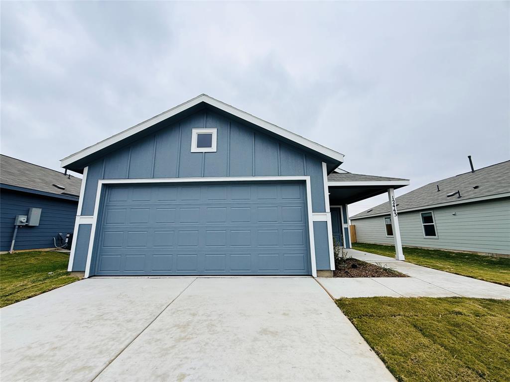 a front view of a house with garage
