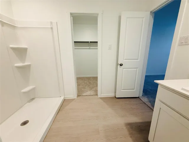 a bathroom with a tub and sink