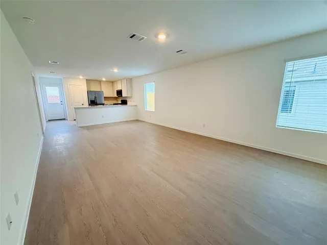 a view of a kitchen with a sink and a window