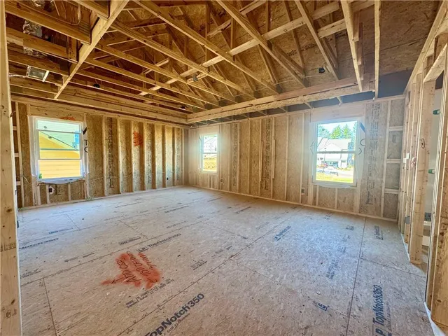 a view of a room with wooden walls