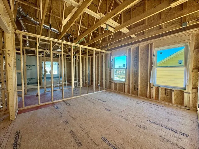 a view of a house with swimming pool and sitting area