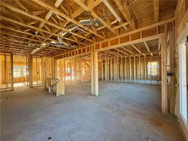 a view of an empty room with windows