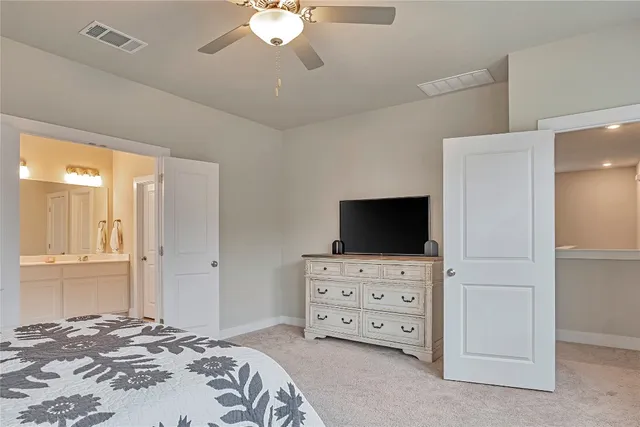 a living room with furniture and flat screen tv