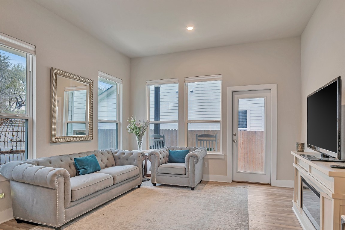 175 Brooks Ranch Drive Kyle, TX 78640 - Photo 10 of 30 a living room with furniture and a flat screen tv