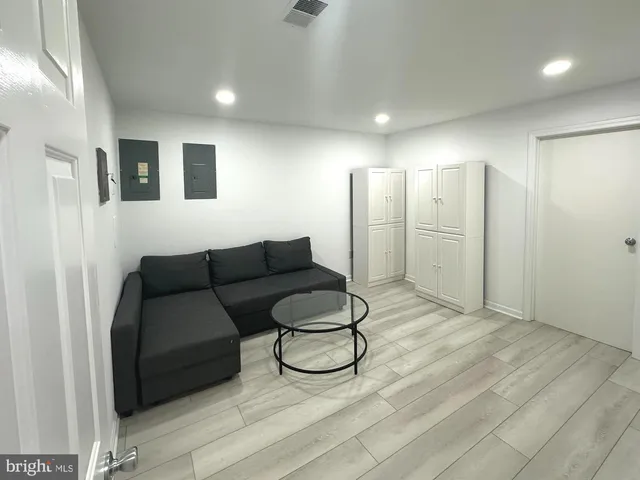 a living room with furniture and a rug