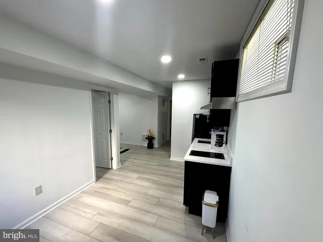 a bedroom with a bed and a desk