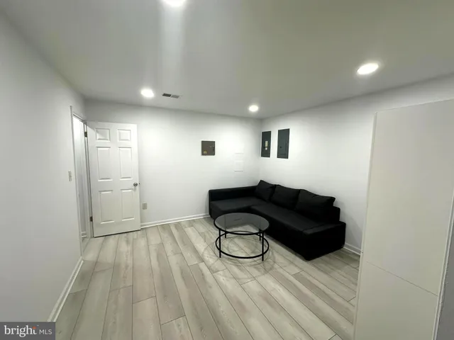 a bathroom with a sink toilet and mirror