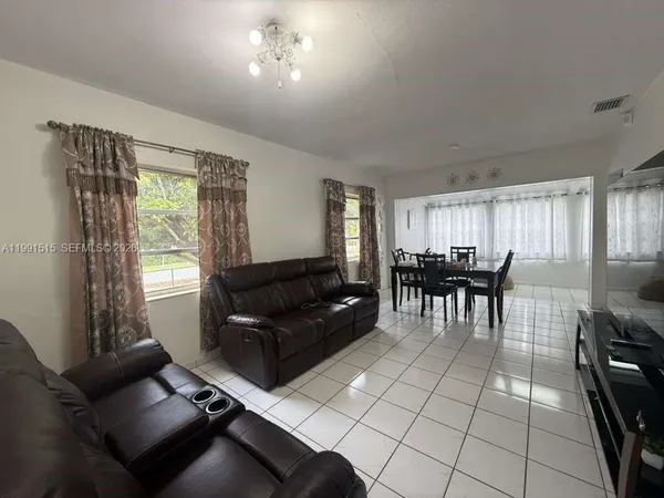a living room with furniture and a window