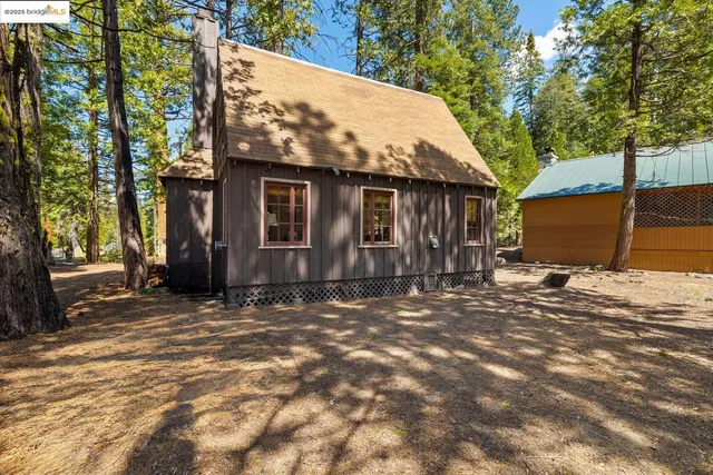 a view of a house with a tree