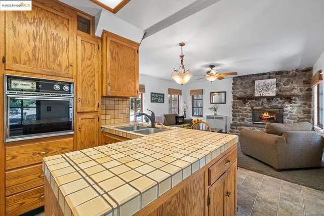 a living room with fireplace furniture and a flat screen tv