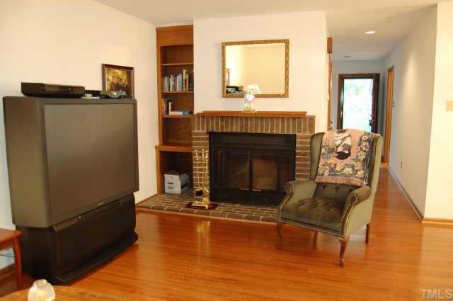 48 Stoneridge Road Durham, NC 27705 - Photo 4 of 8 a living room with furniture and a fireplace
