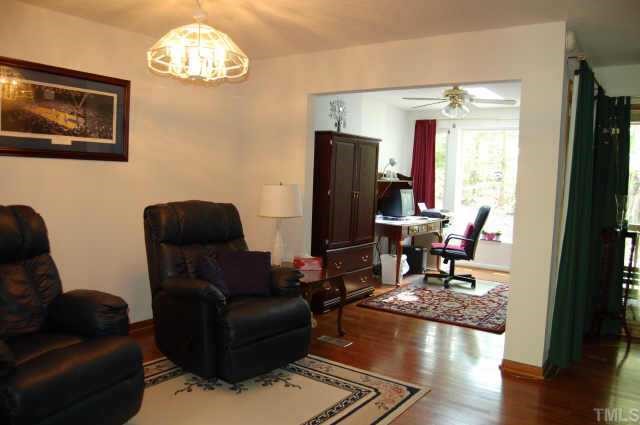 48 Stoneridge Road Durham, NC 27705 - Photo 7 of 8 a living room with furniture wooden floor and a window
