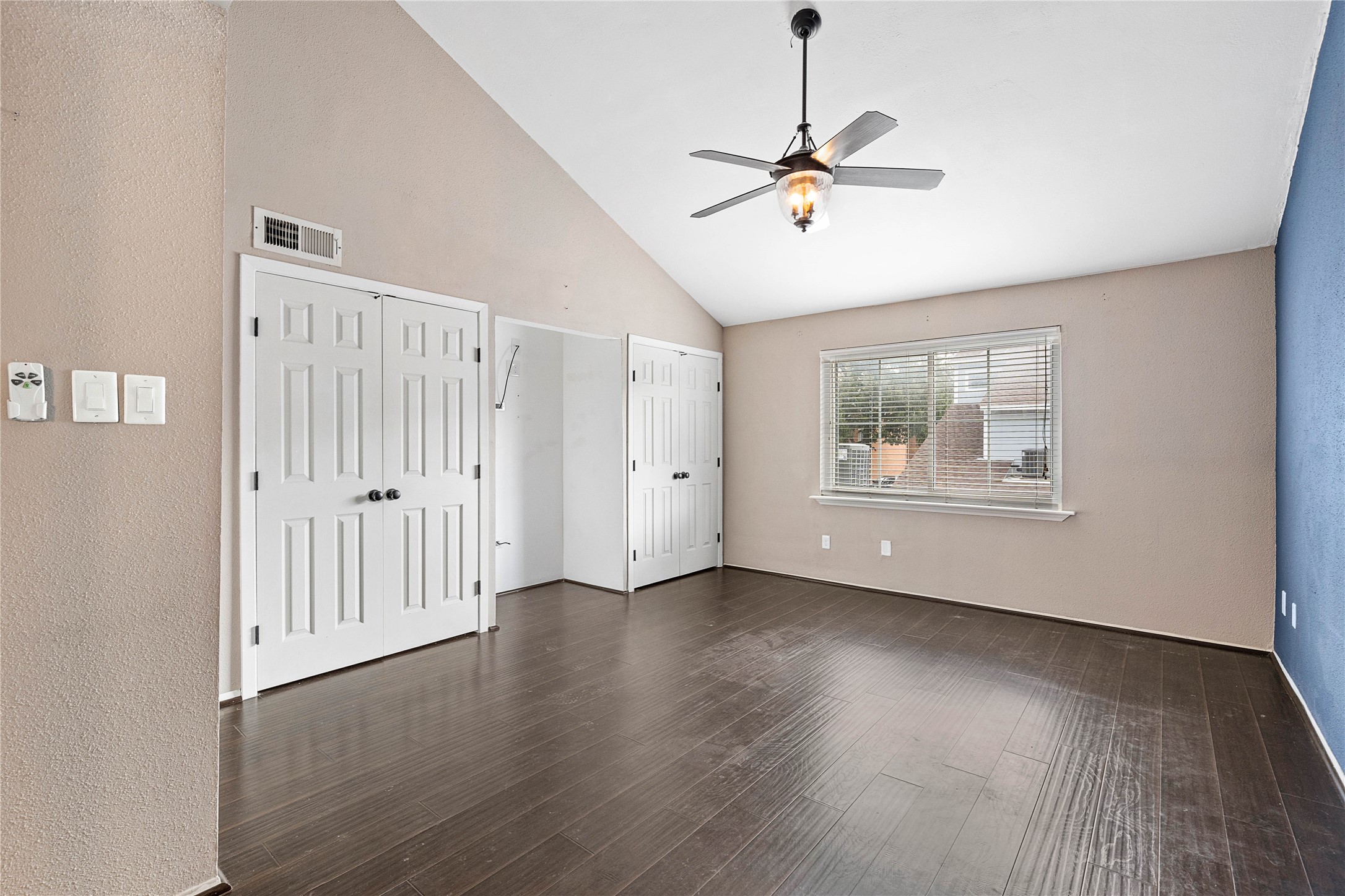 3200 South Gessner Road, Unit 330 Houston, TX 77063 - Photo 14 of 27 a view of an empty room with wooden floor and a window