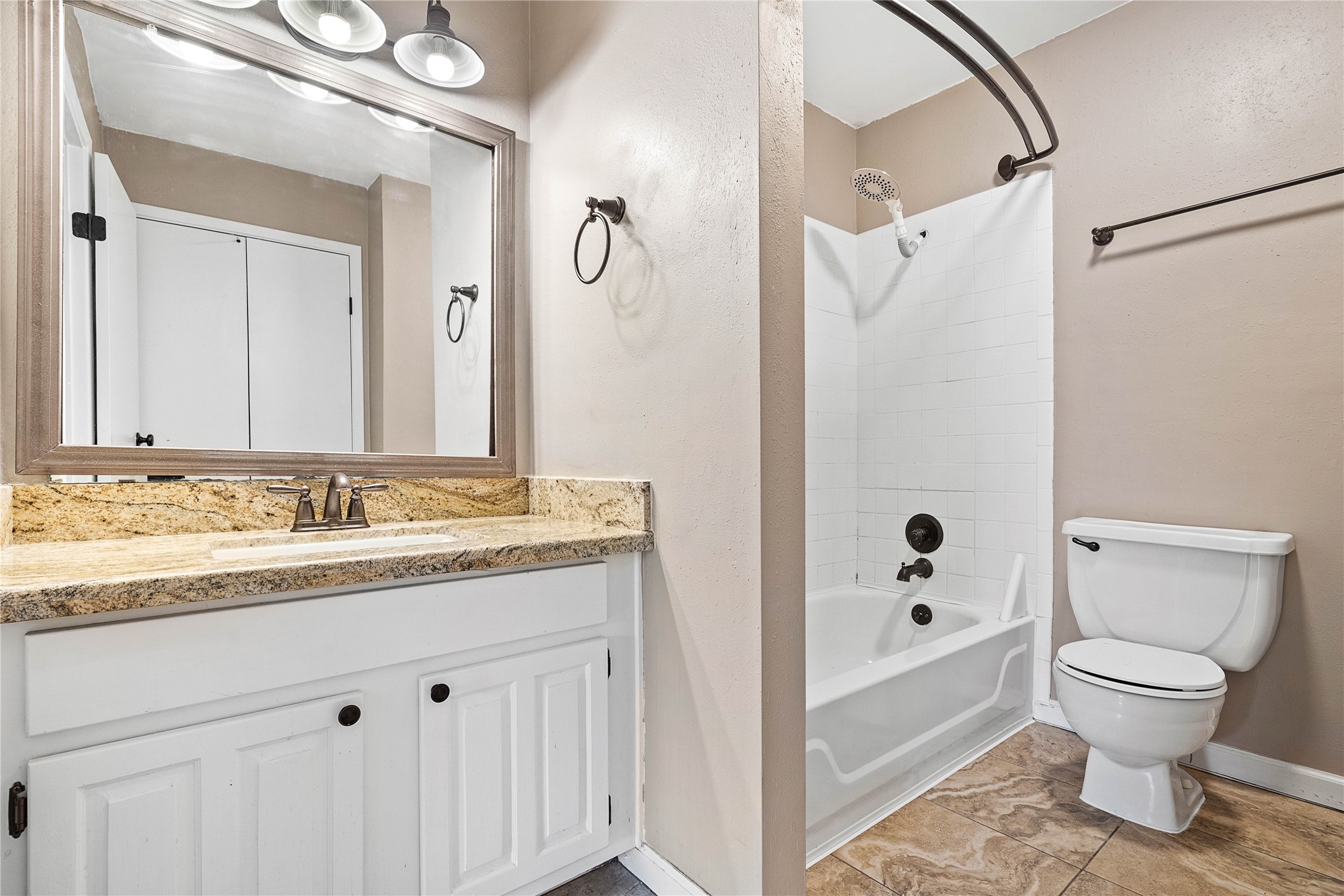 3200 South Gessner Road, Unit 330 Houston, TX 77063 - Photo 15 of 27 a bathroom with a granite countertop sink toilet and shower