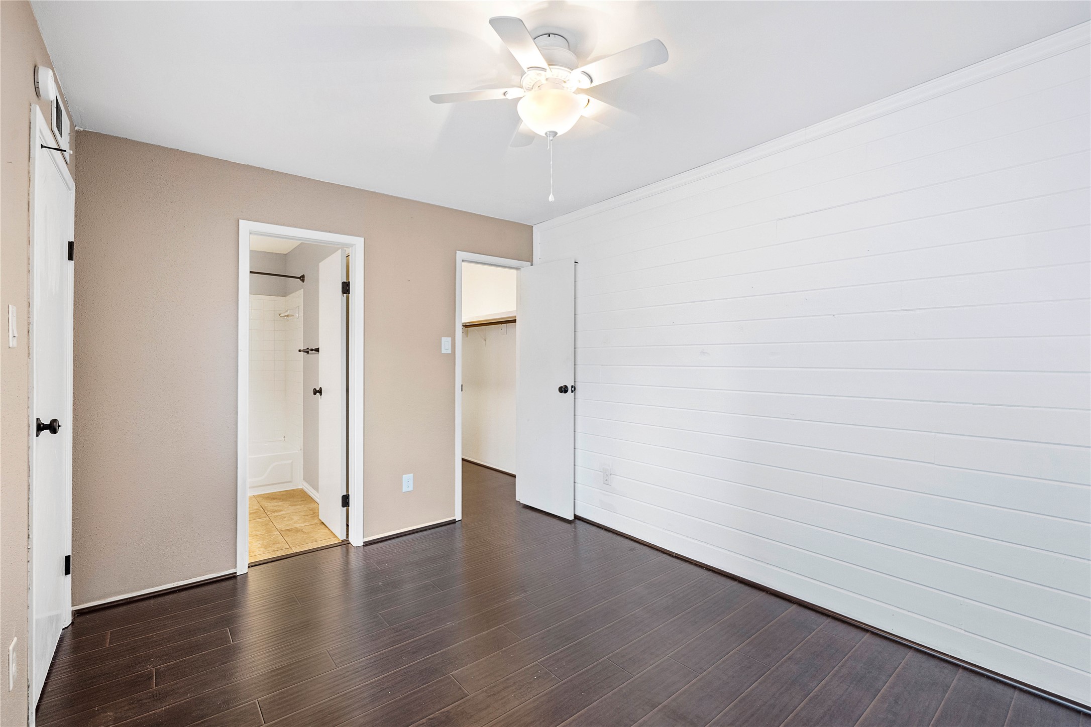 3200 South Gessner Road, Unit 330 Houston, TX 77063 - Photo 18 of 27 an empty room with wooden floor and a ceiling fan