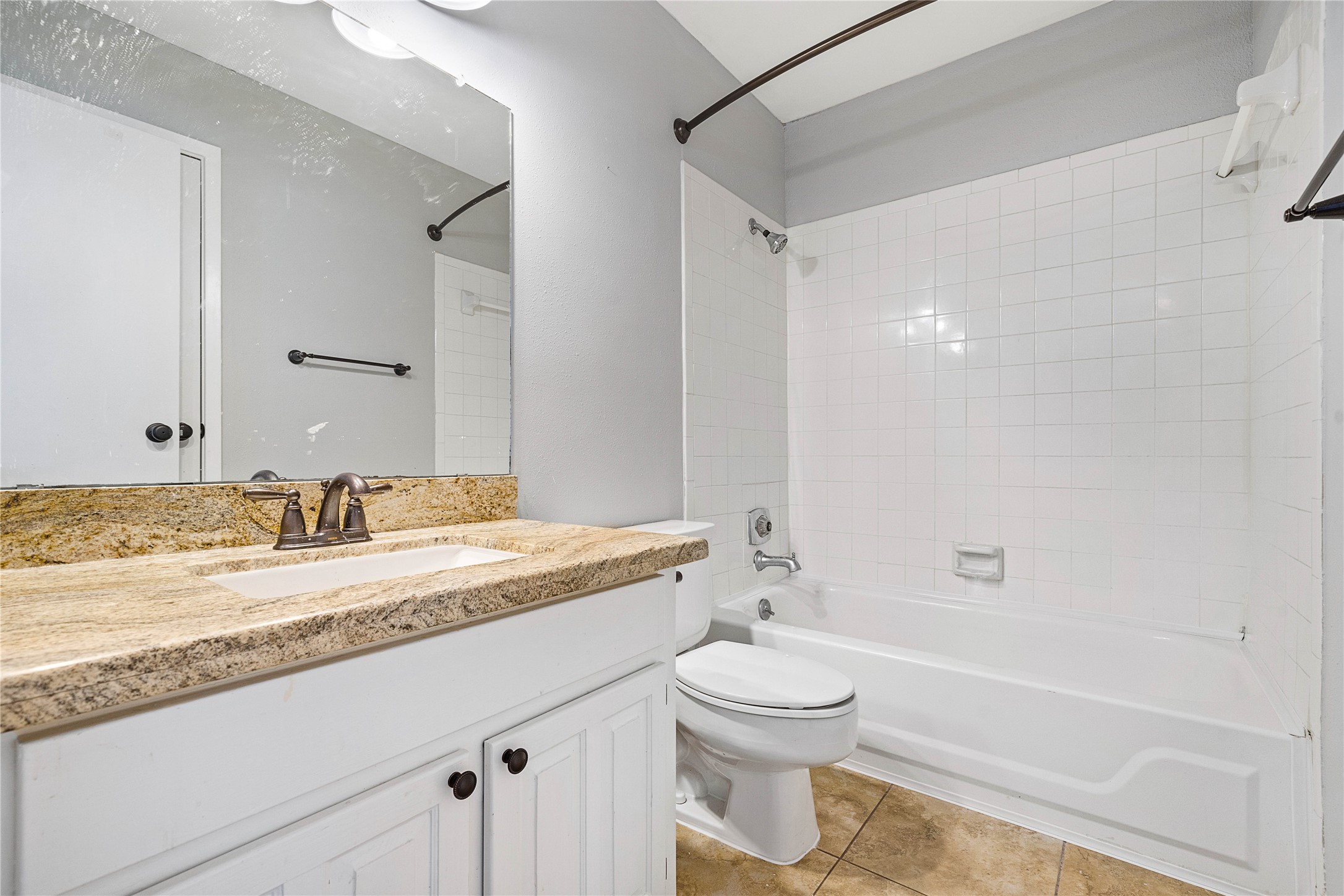 3200 South Gessner Road, Unit 330 Houston, TX 77063 - Photo 19 of 27 a bathroom with a granite countertop sink toilet and shower