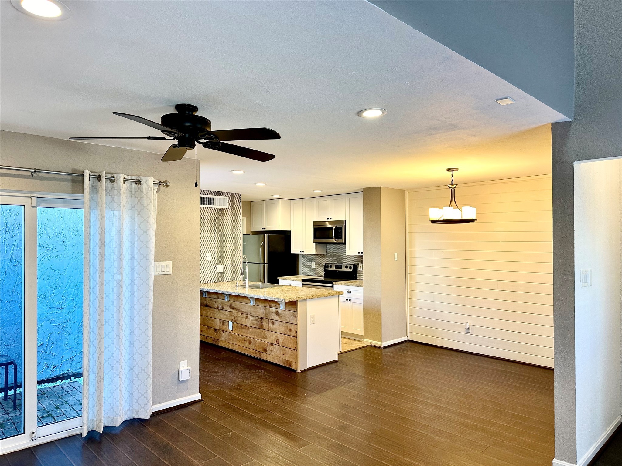 3200 South Gessner Road, Unit 330 Houston, TX 77063 - Photo 3 of 27 a view of a kitchen with a sink and a ceiling fan