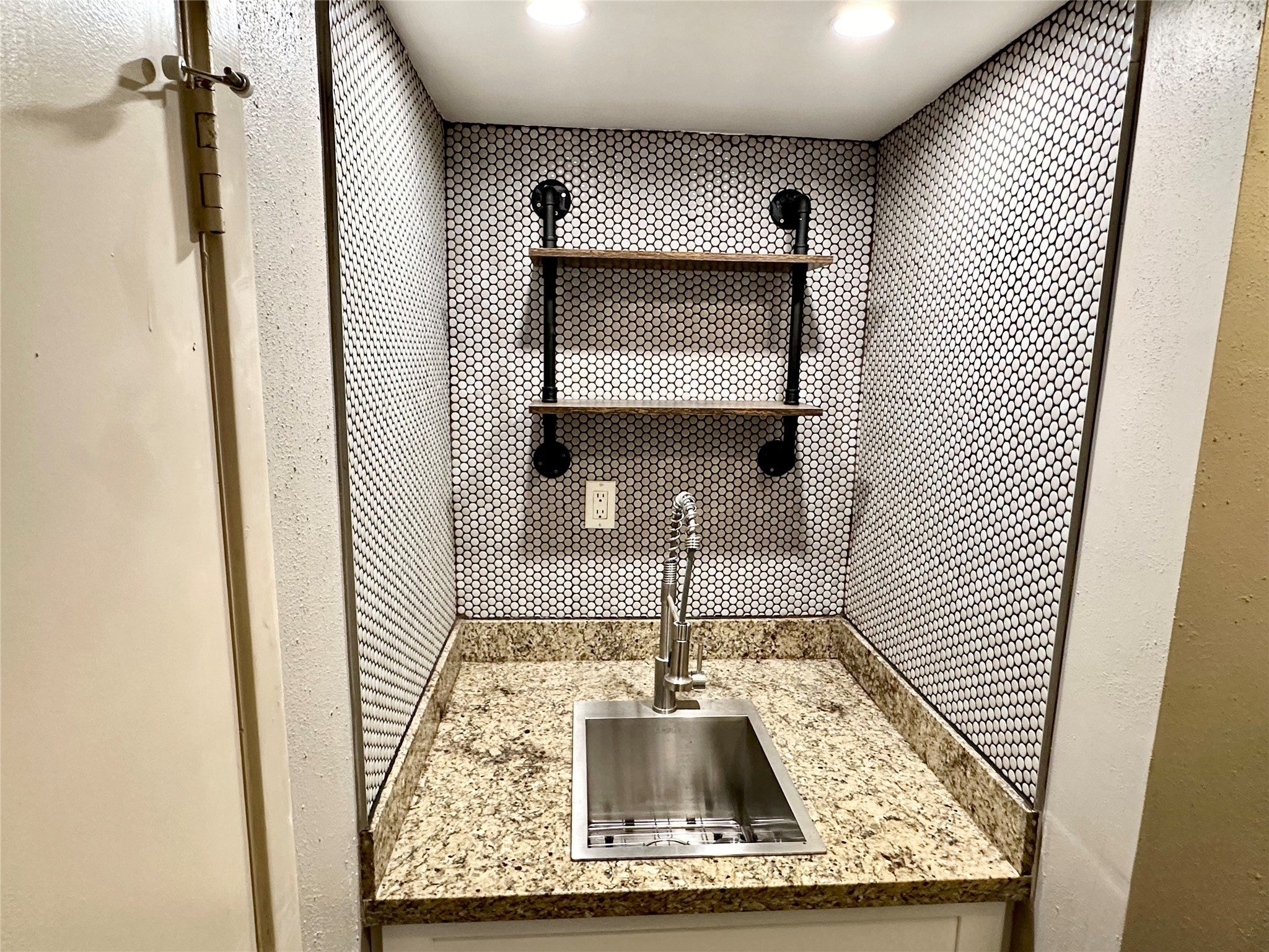 3200 South Gessner Road, Unit 330 Houston, TX 77063 - Photo 7 of 27 a view of a kitchen from a hallway