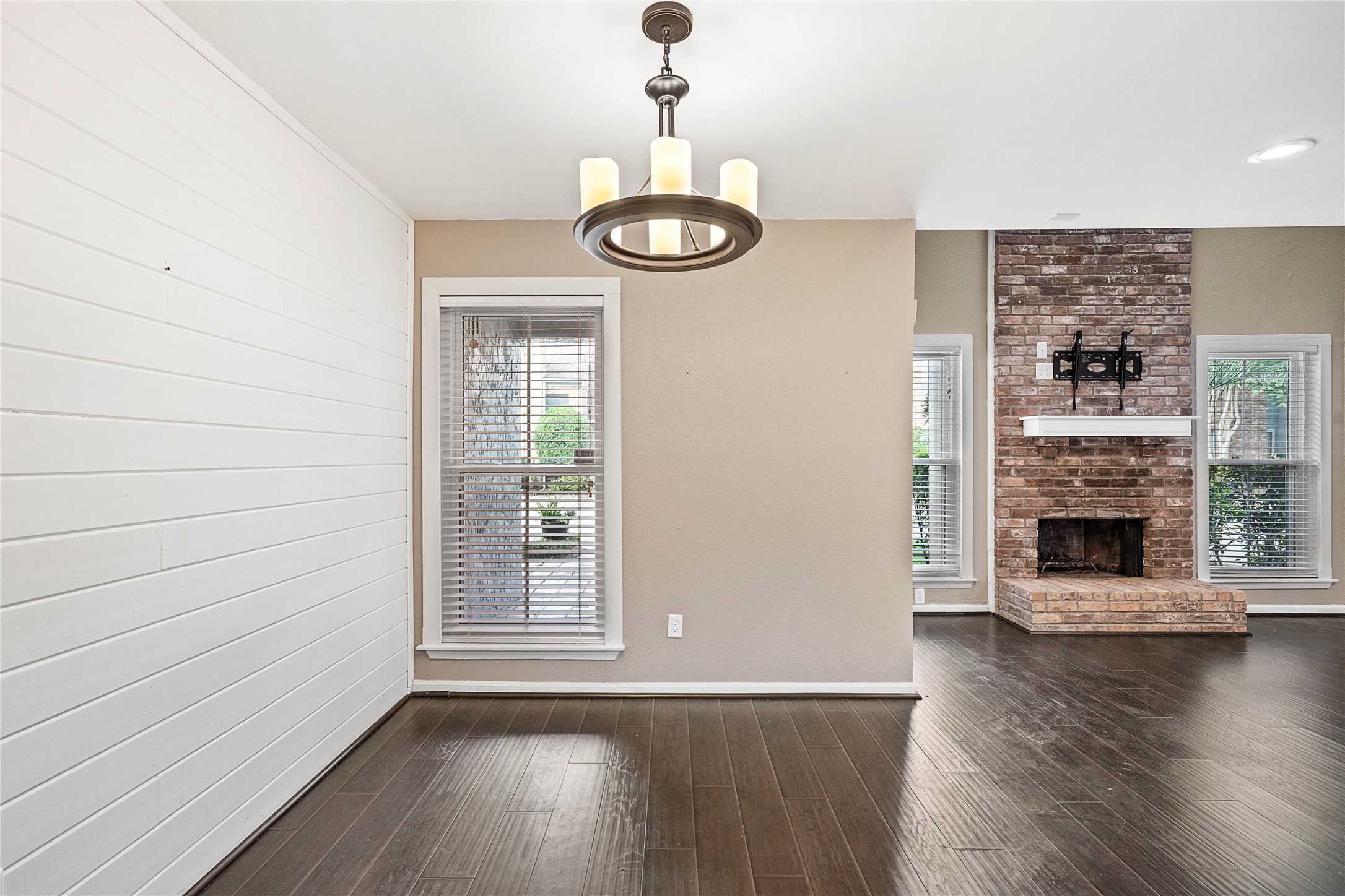 3200 South Gessner Road, Unit 330 Houston, TX 77063 - Photo 9 of 27 a view of an empty room with wooden floor and a window