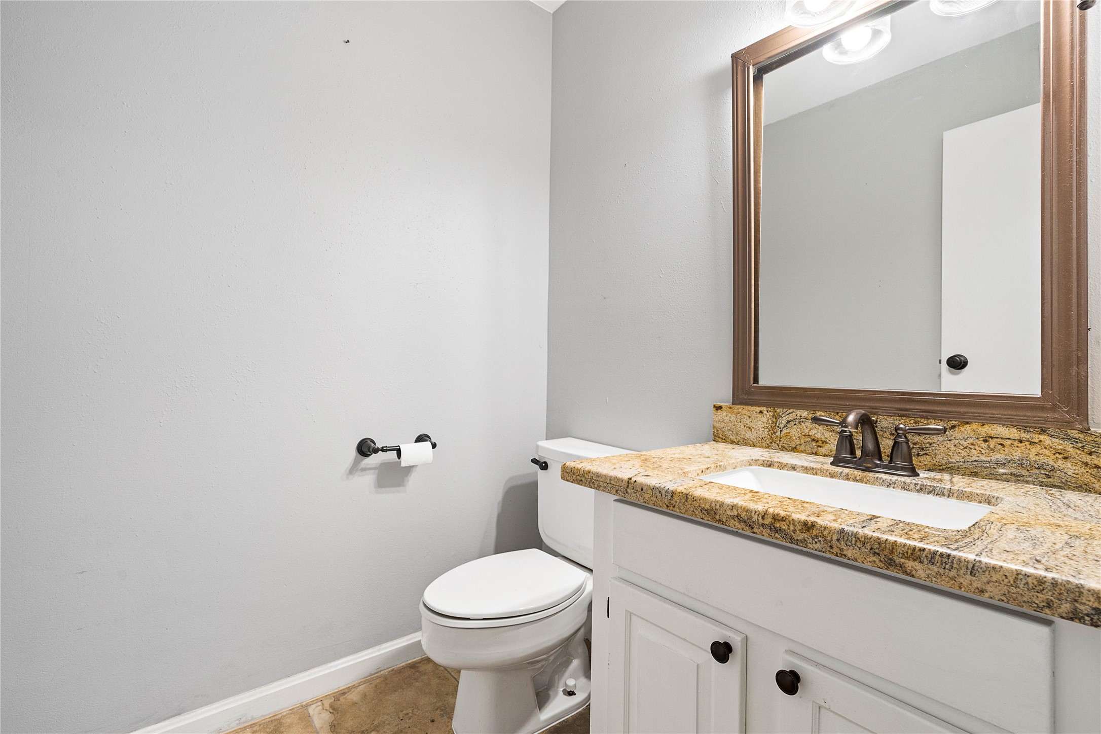 3200 South Gessner Road, Unit 330 Houston, TX 77063 - Photo 10 of 27 a bathroom with a granite countertop sink mirror and toilet