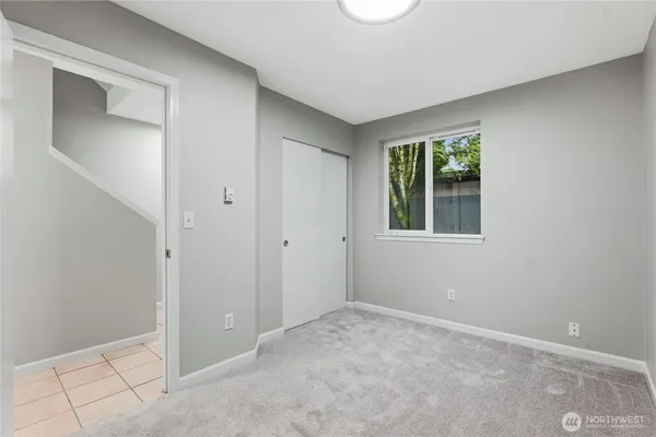 a view of an empty room with a window