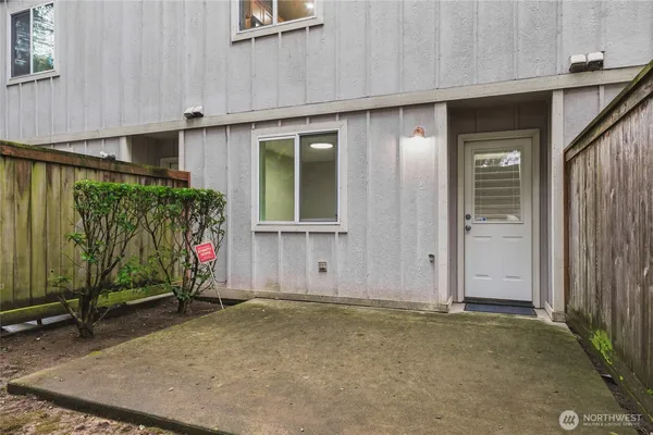 an entrance to house with yard