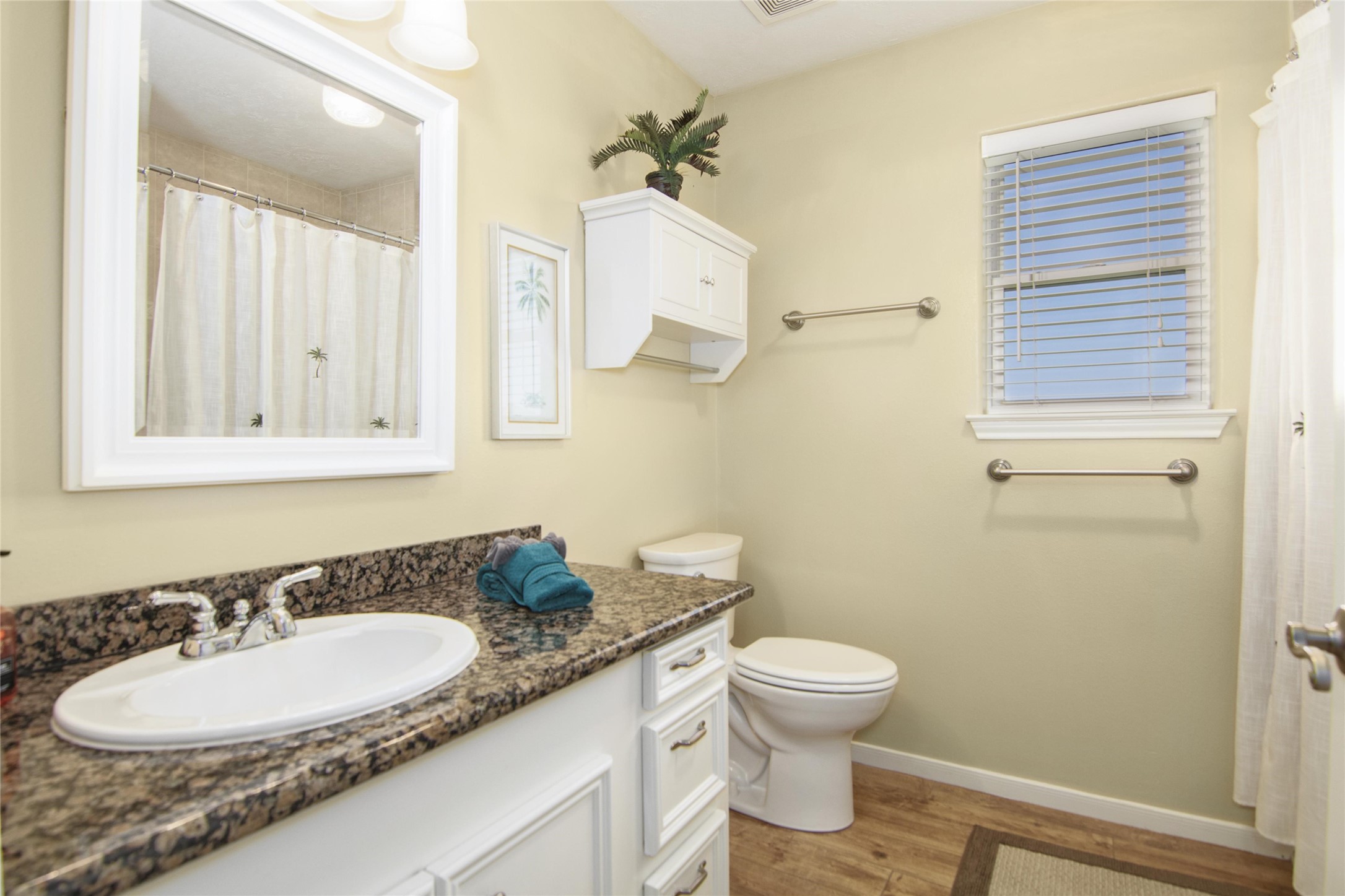 3933 Biscayne Beach Road Port Bolivar, TX 77650 - Photo 14 of 24 a bathroom with a granite countertop sink toilet a mirror and a shower