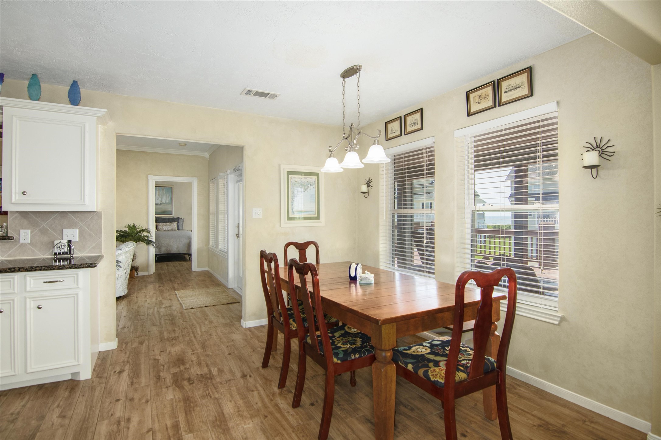 3933 Biscayne Beach Road Port Bolivar, TX 77650 - Photo 24 of 24 a view of a dining room with furniture window and wooden floor