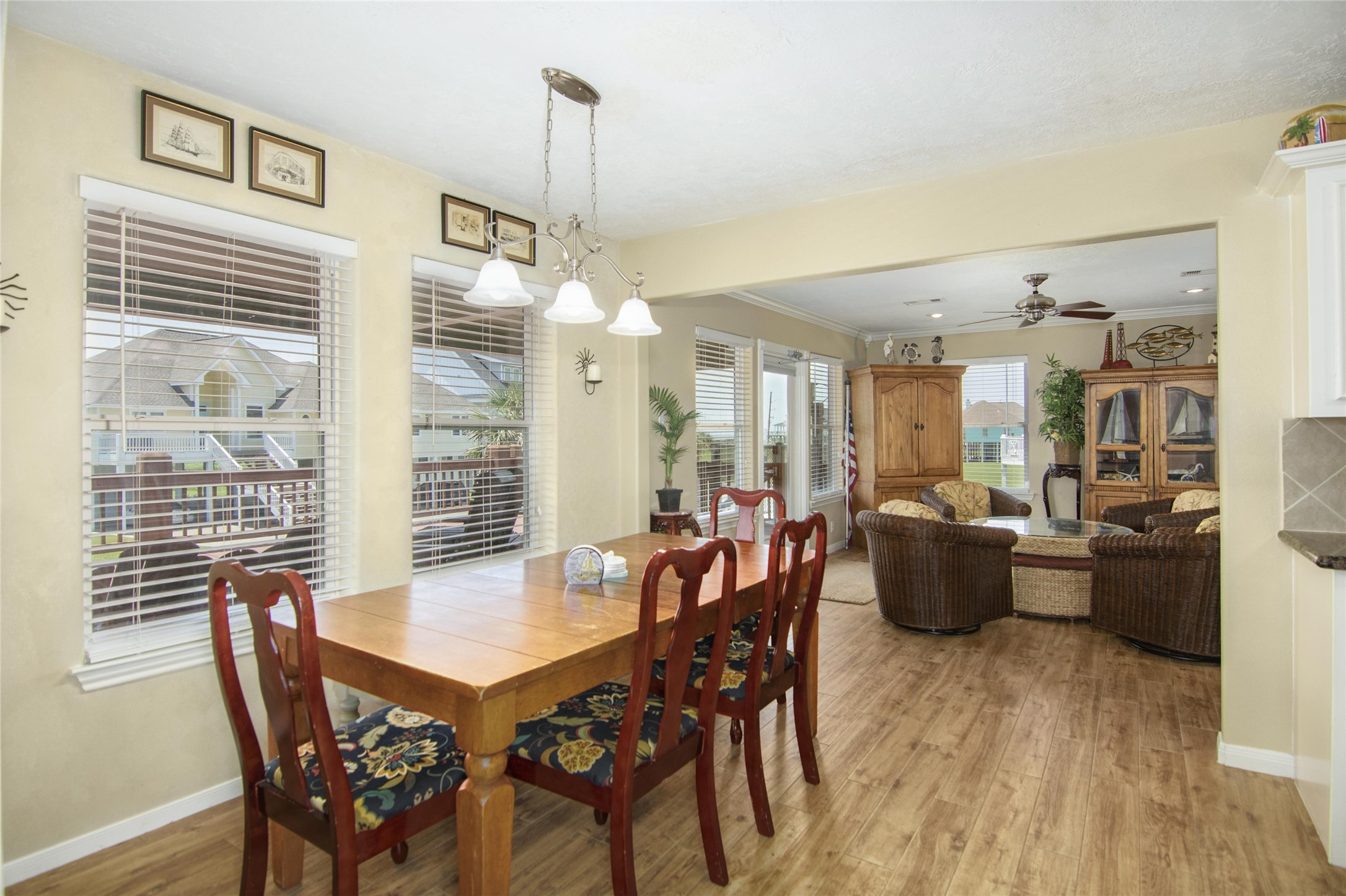 3933 Biscayne Beach Road Port Bolivar, TX 77650 - Photo 6 of 24 a view of a dining room with furniture window and wooden floor