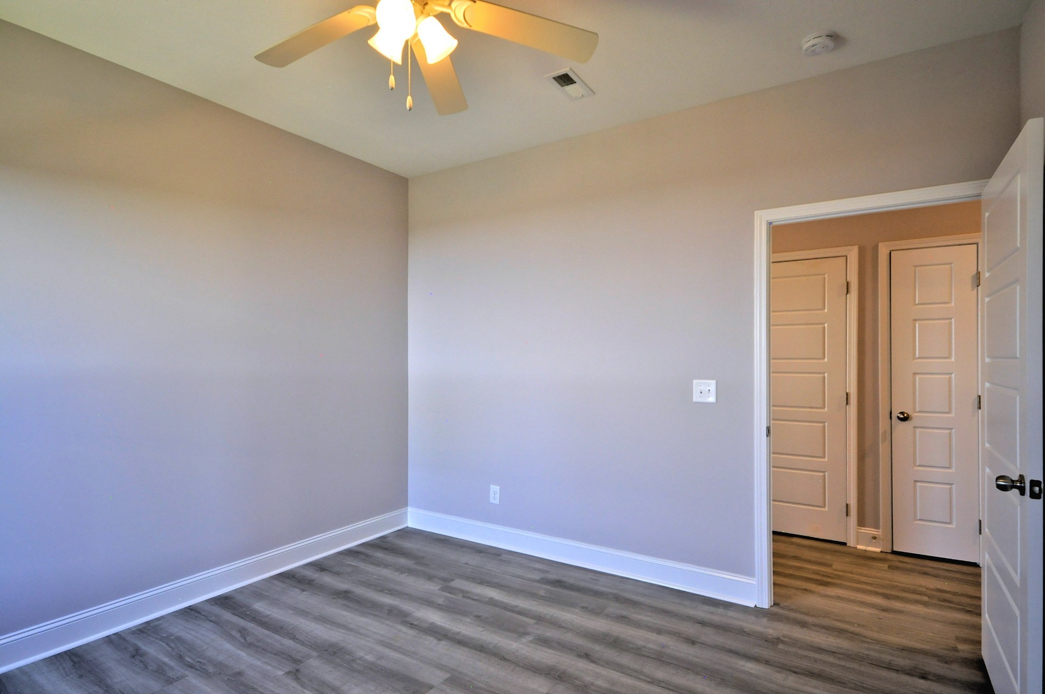 179 Bainbridge Drive, Unit A Clarksville, TN 37043 - Photo 19 of 33 a view of an empty room with wooden floor