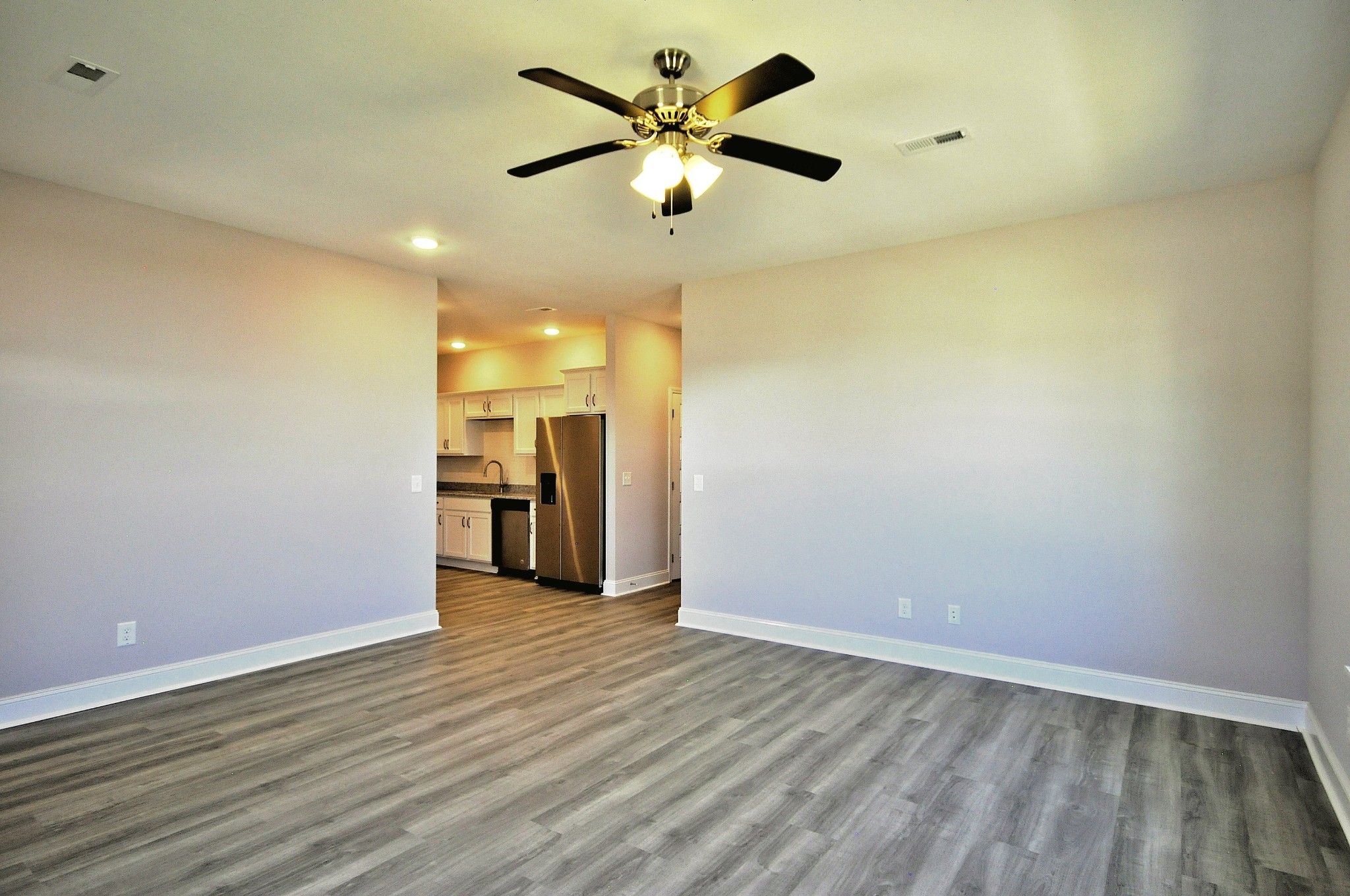 179 Bainbridge Drive, Unit A Clarksville, TN 37043 - Photo 6 of 33 wooden floor in an empty room with a window