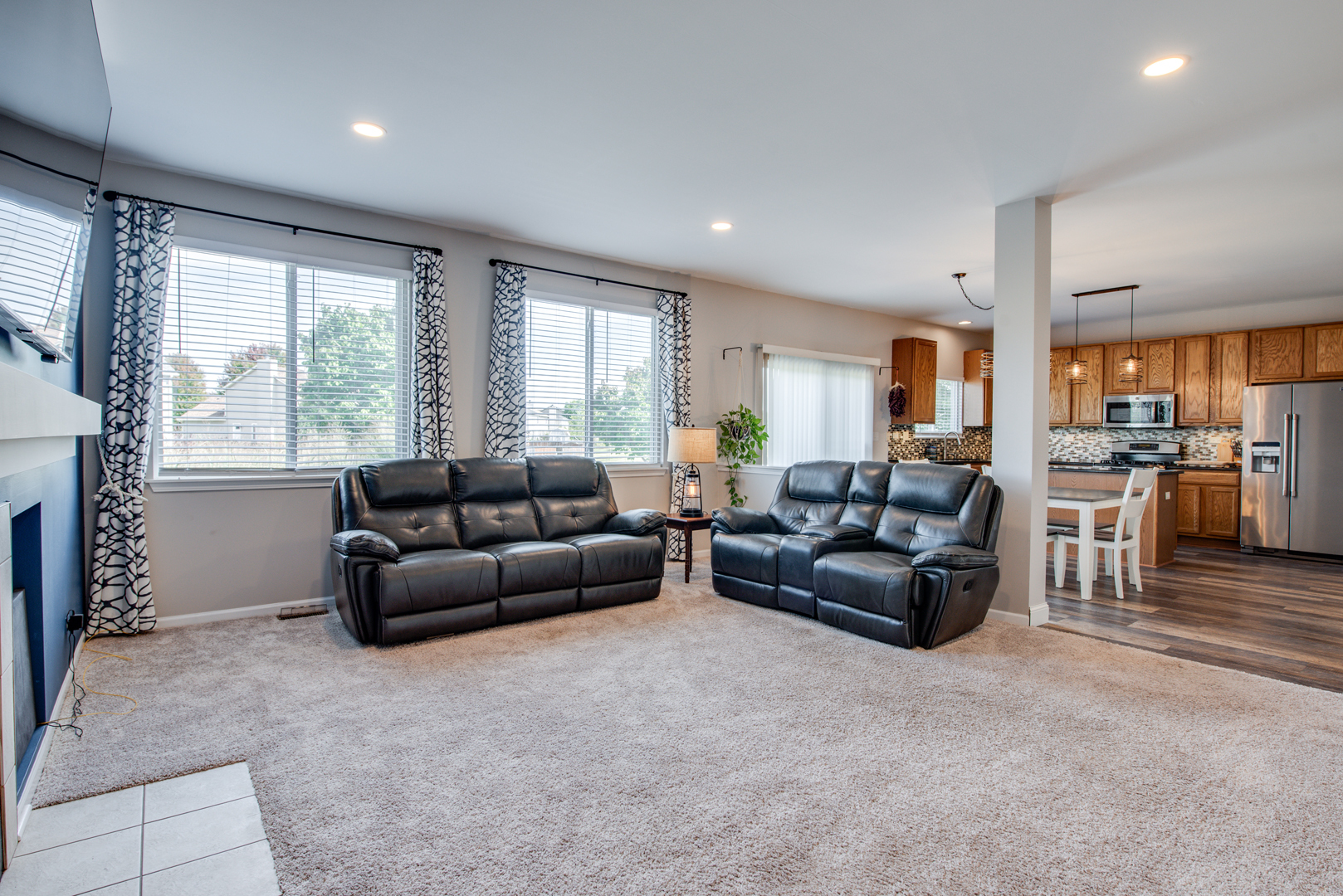 416 Hubbard Circle Plano, IL 60545 - Photo 13 of 57 a living room with furniture and a large window