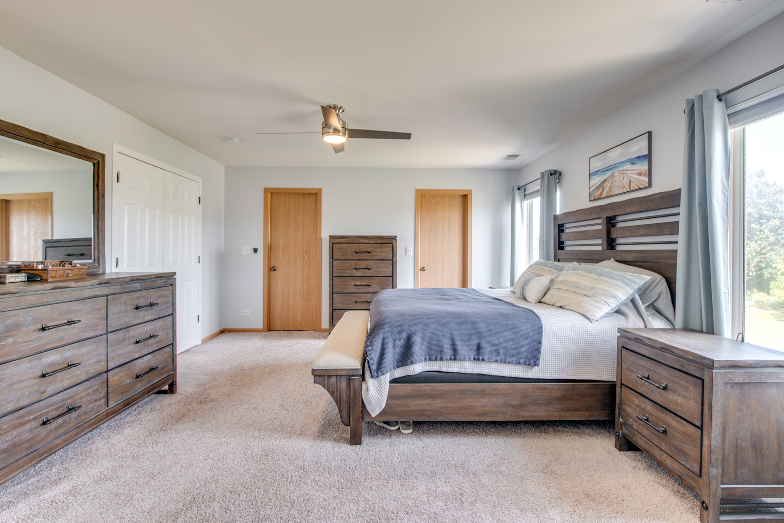 416 Hubbard Circle Plano, IL 60545 - Photo 17 of 57 a spacious bedroom with a bed and a dresser