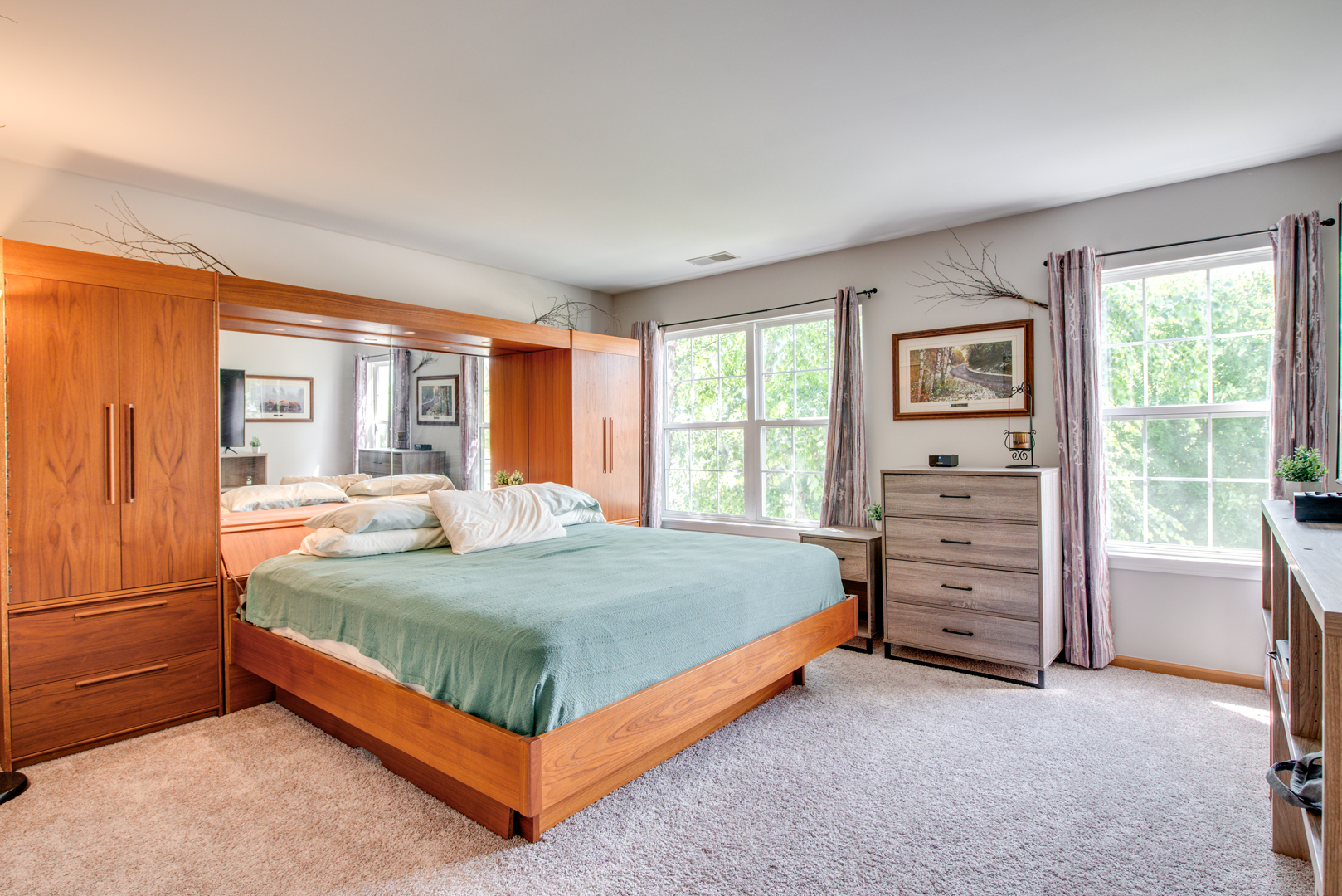 416 Hubbard Circle Plano, IL 60545 - Photo 21 of 57 a bed sitting in a bedroom next to a window