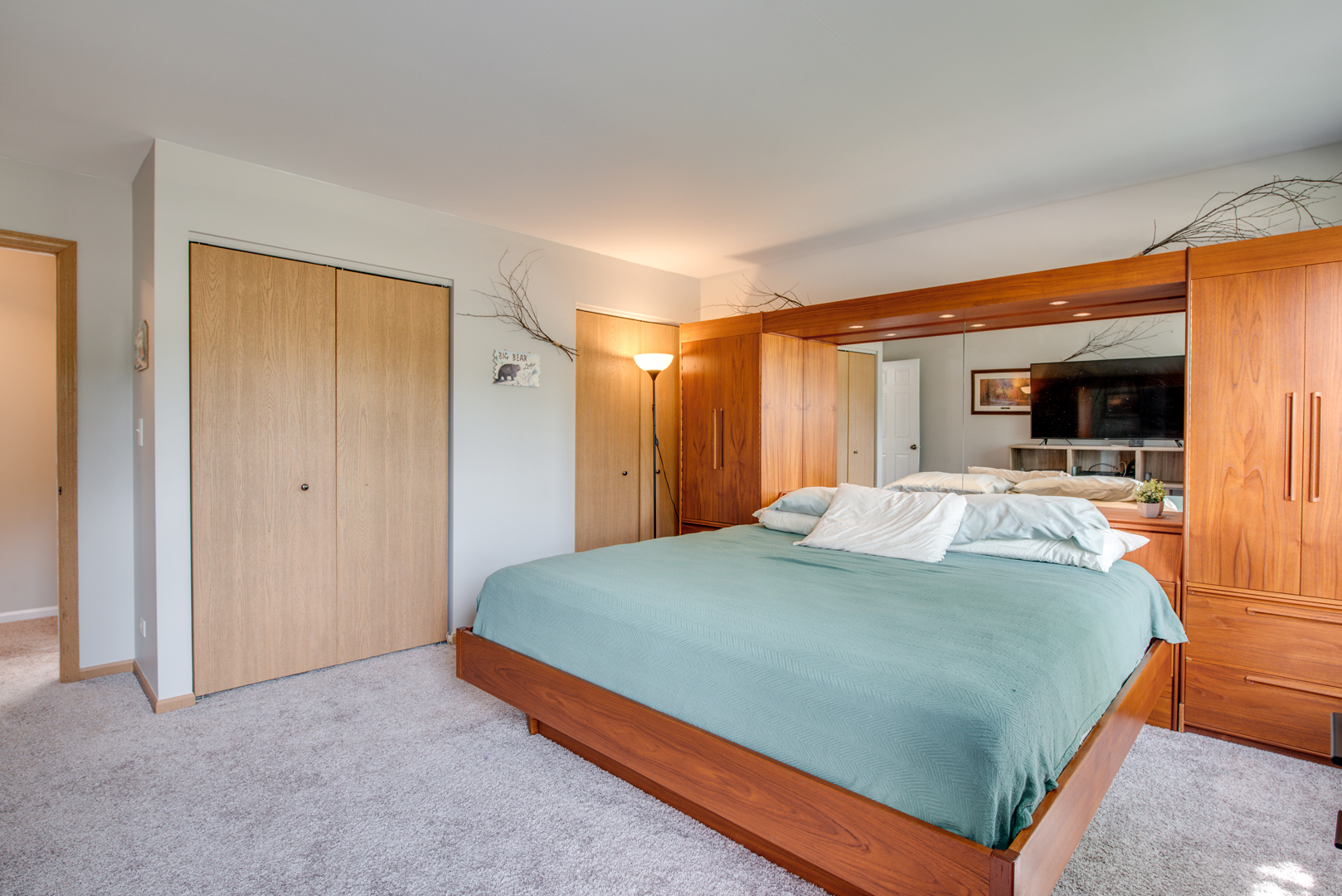 416 Hubbard Circle Plano, IL 60545 - Photo 22 of 57 a bed sitting in a spacious bedroom next to a window and a flat screen tv
