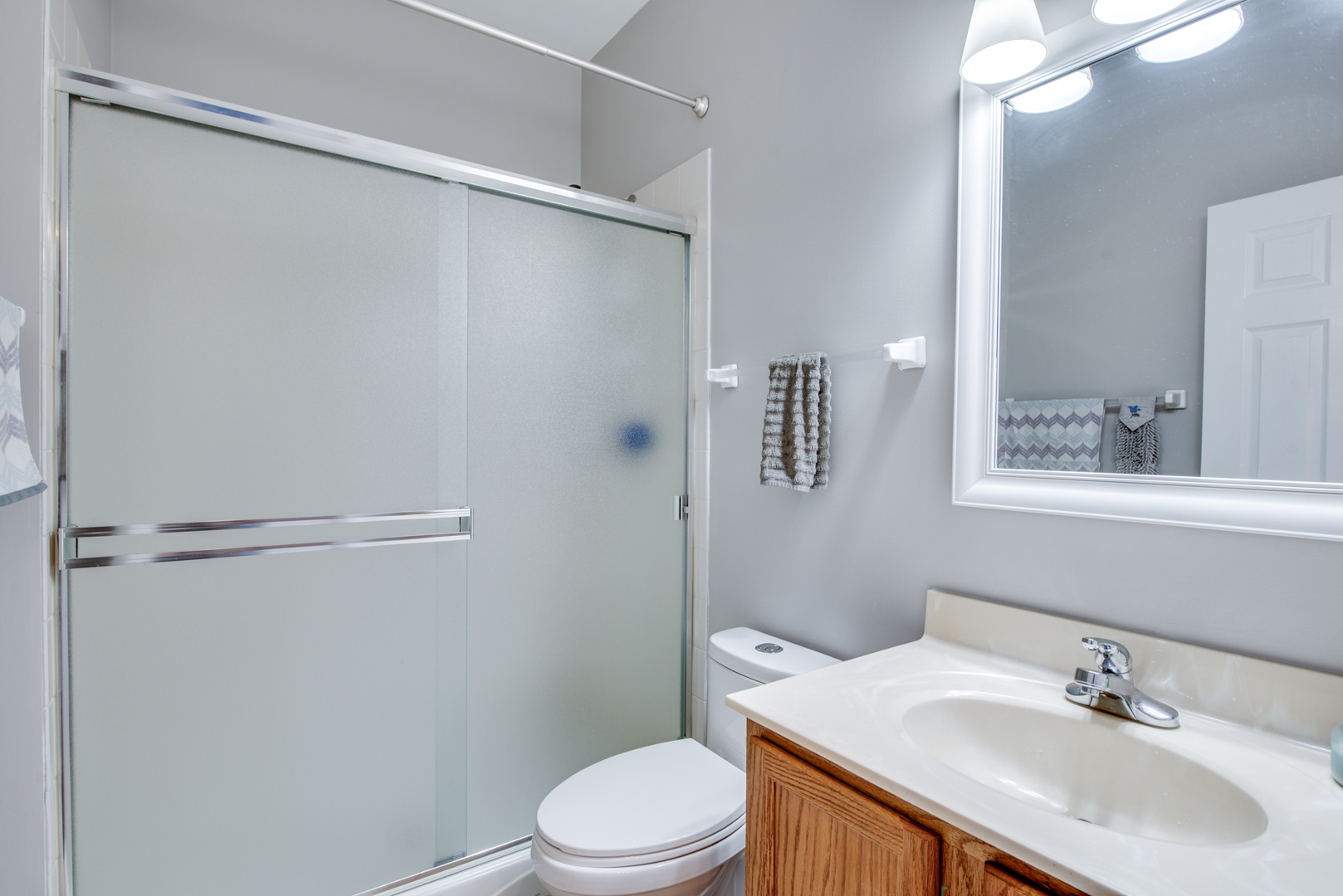 416 Hubbard Circle Plano, IL 60545 - Photo 29 of 57 a bathroom with a sink toilet and shower