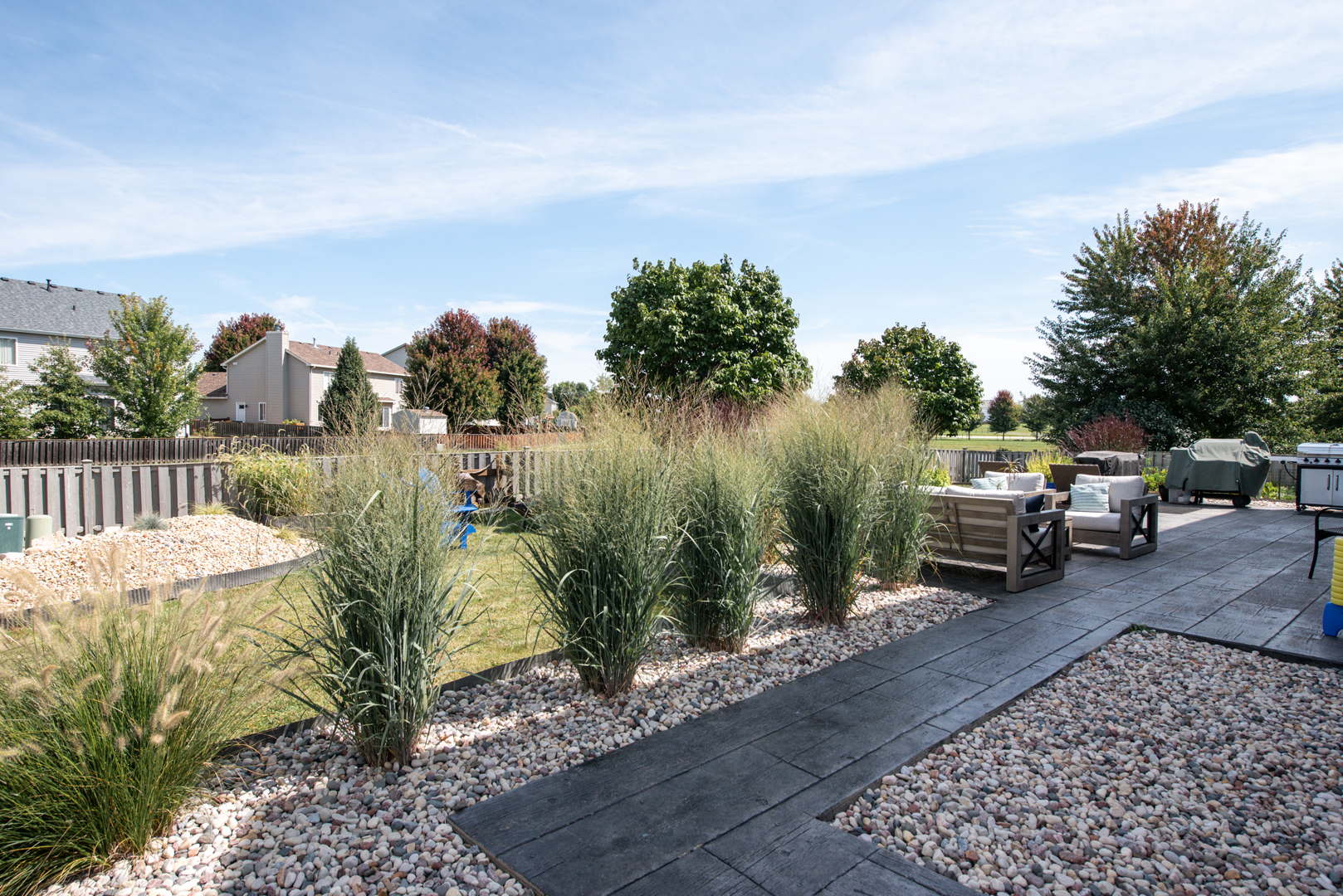 416 Hubbard Circle Plano, IL 60545 - Photo 32 of 57 a terrace with outdoor seating and trees
