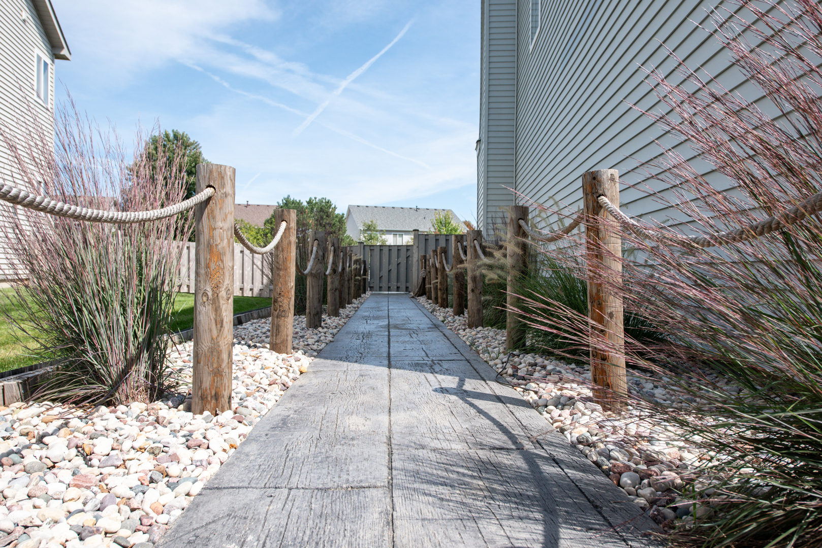 416 Hubbard Circle Plano, IL 60545 - Photo 35 of 57 a view of a pathway with a bench in patio